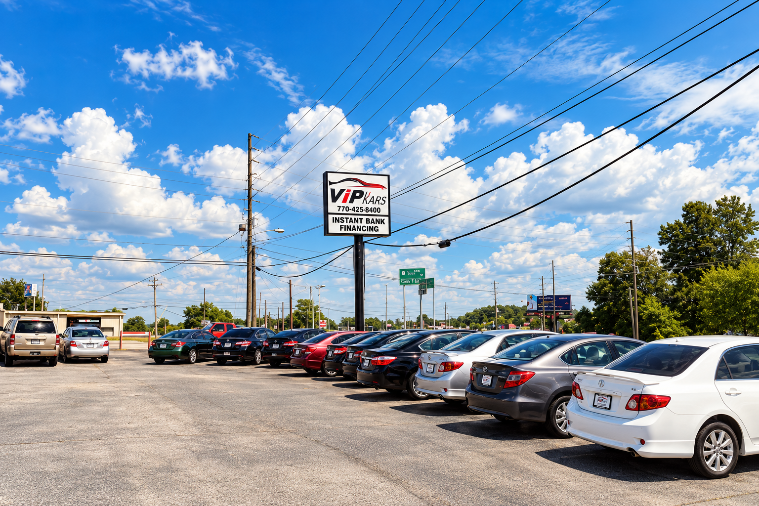 VIP Kars dealership lot and roadside sign in Atlanta, Georgia